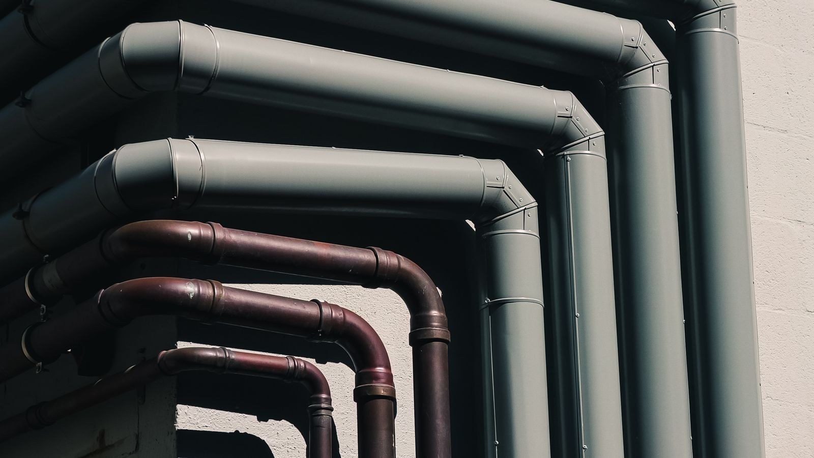 Pipes running along a building wall
